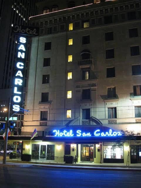 Hotel San Carlos with its illuminated signs at night in Phoenix